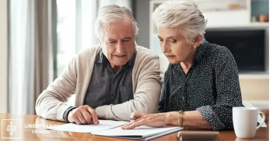 Cropped shot of a senior couple sitting together and going through their finances at home